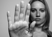 Woman raising her hand to say stop